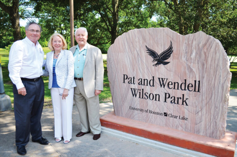 Wilsons, Wendell And Pat And Staples With Park Sign 900x596